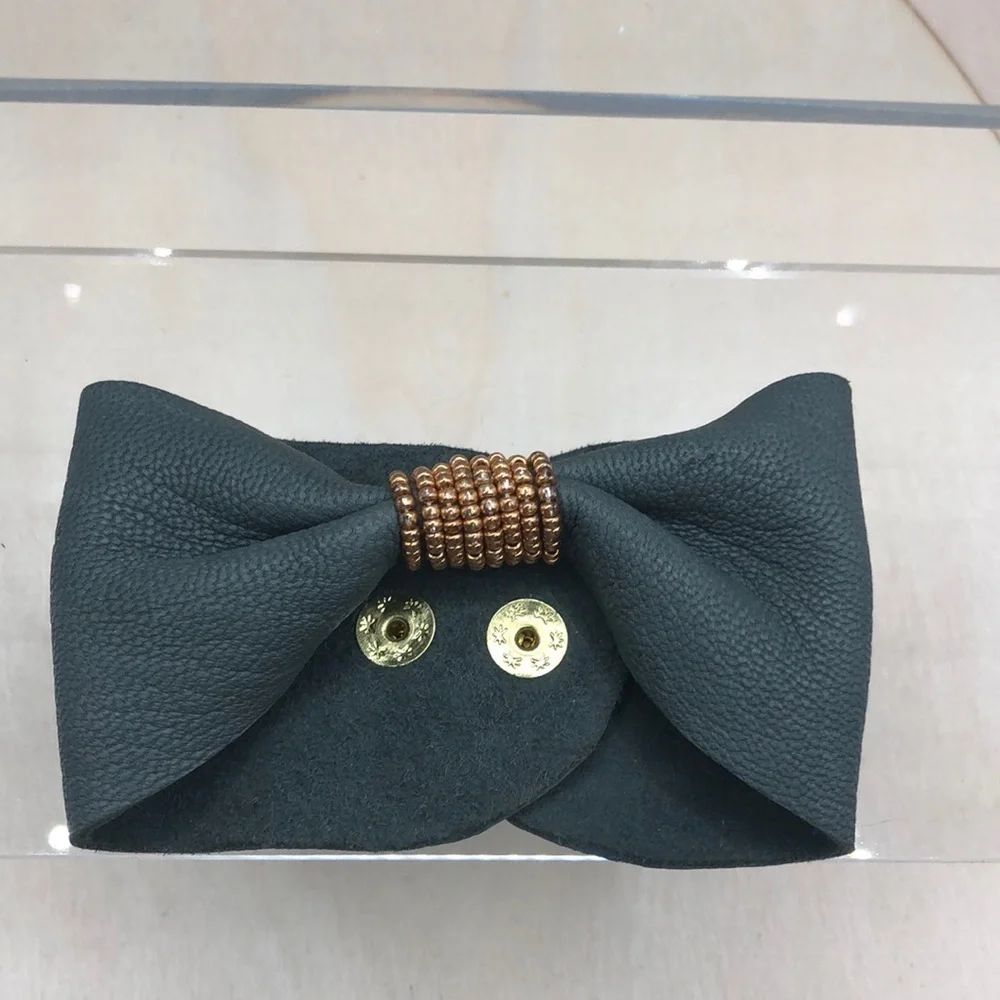 Soft leather bow shaped bracelet.